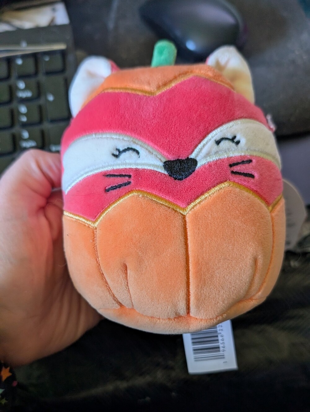 Squishmallow Fifi the Fox inside a Halloween Pumpkin